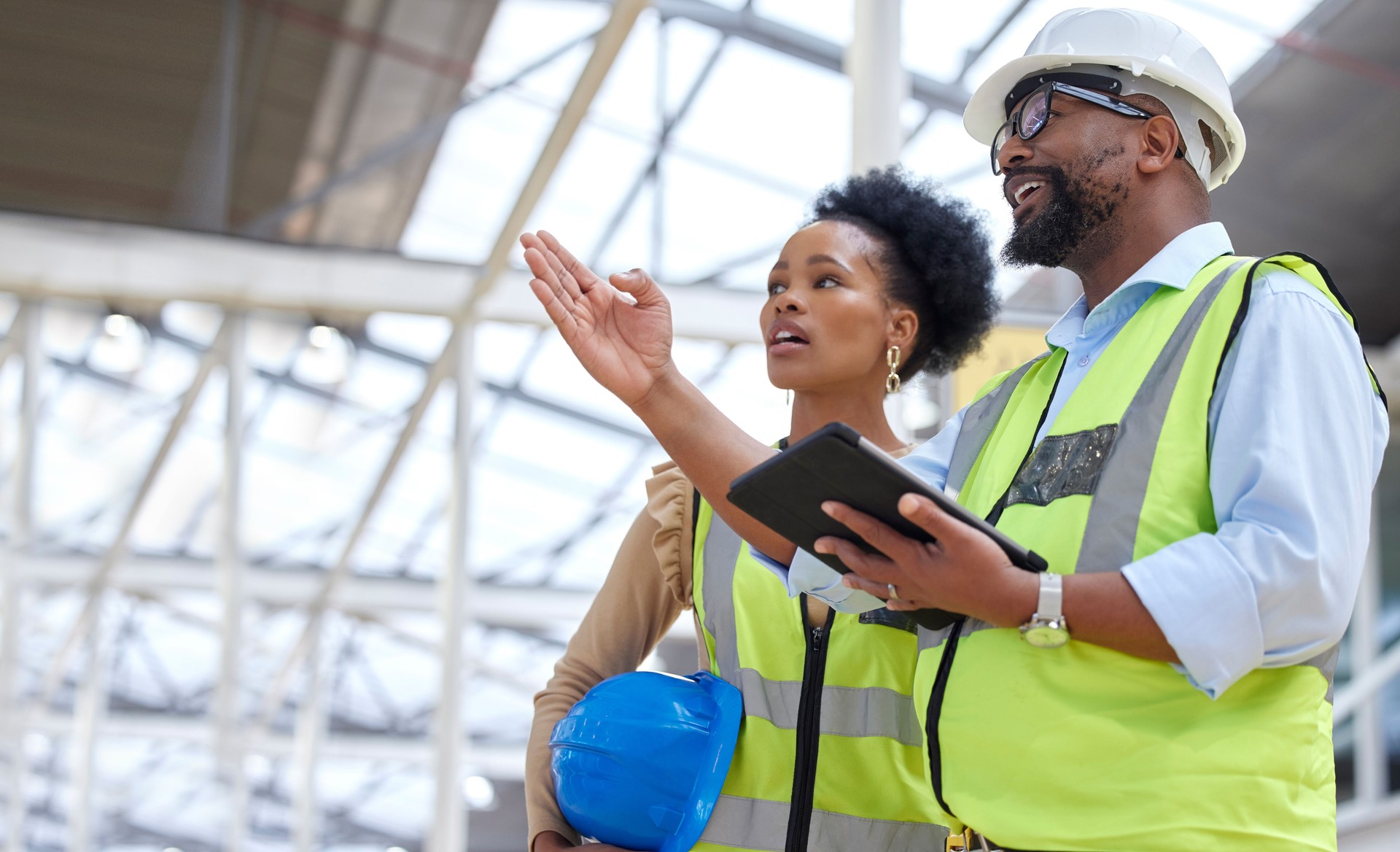 Construction team, tablet and inspection planning from engineer staff at job site. Collaboration, architect worker and communication together with building and industrial project with conversation